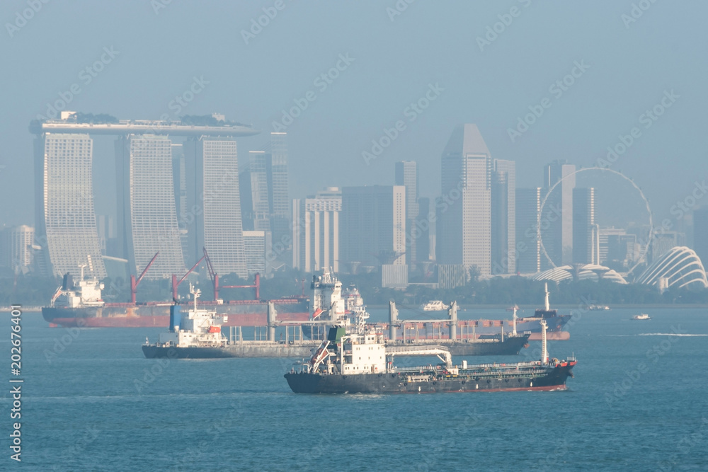cargo ships and buildings of singapore city