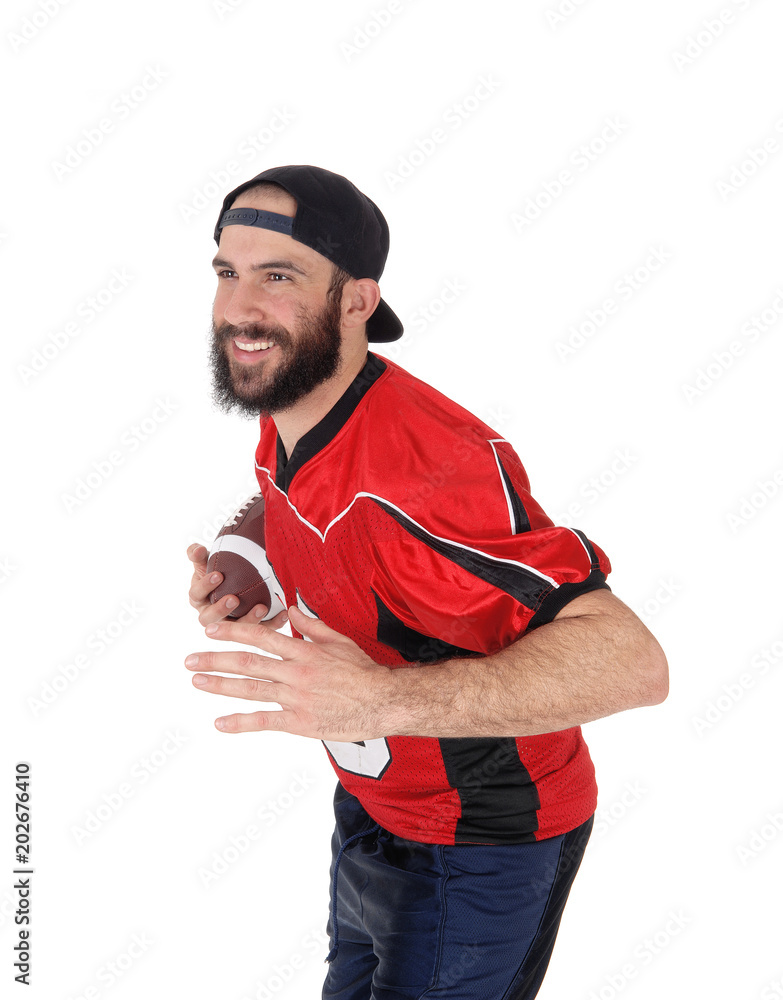 Closeup of a football player with his football in his hand Closeup of a football player with his football in his hand
