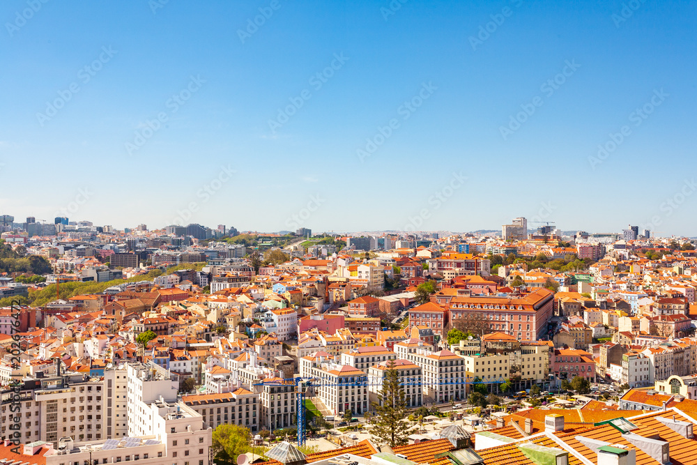 Obraz premium Old Lisbon Portugal panorama. cityscape with roofs. Tagus river. miraduro viewpoint. View from sao jorge castle