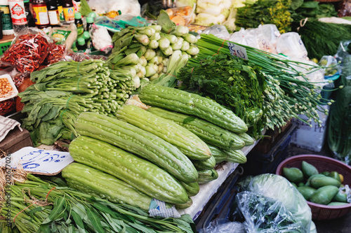 Thai herbs and assorted vegetables on the local street market in Bangkok, Thailand. Asian farmer market selling fresh vegetables