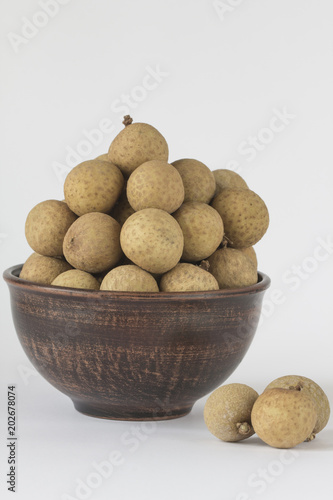 Longan in ceramic pial isolated on white background - (exotic fruit) photo