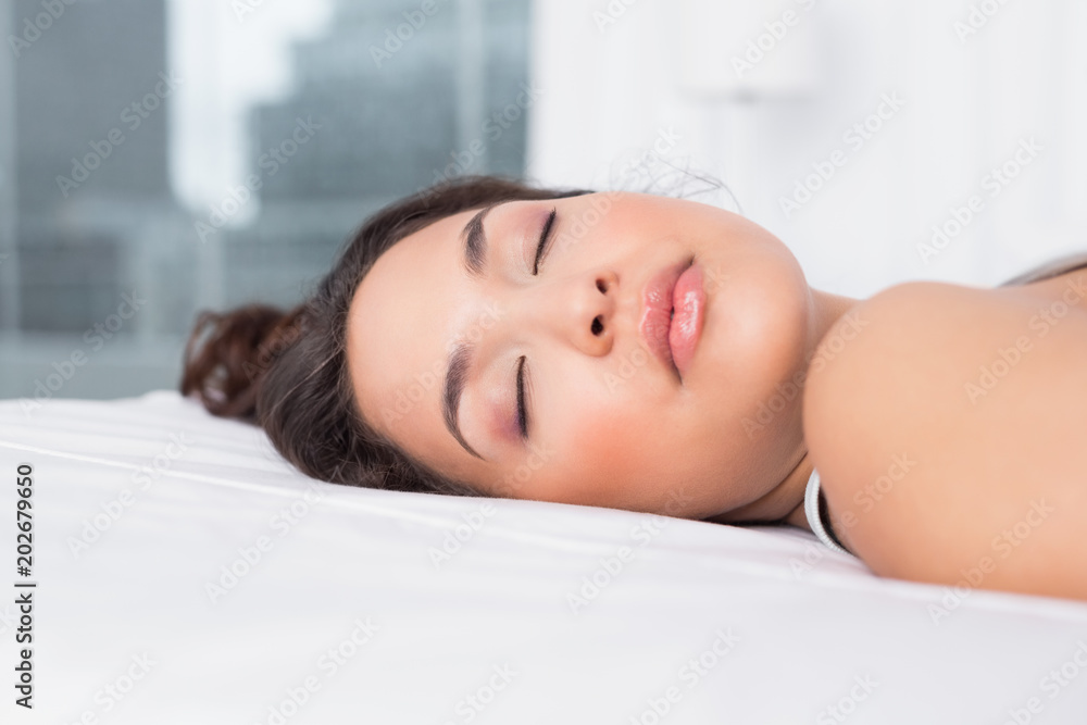 Pretty woman sleeping with eyes closed in bed Pretty woman sleeping with eyes closed in bed