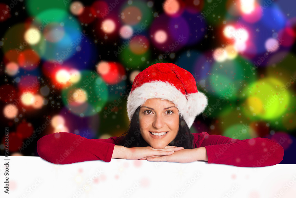 Woman smiling at the camera against blurred lights Woman smiling at the camera against blurred lights