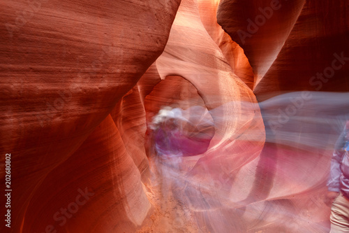 Visitors crossing inside Lower Antelope Canyon