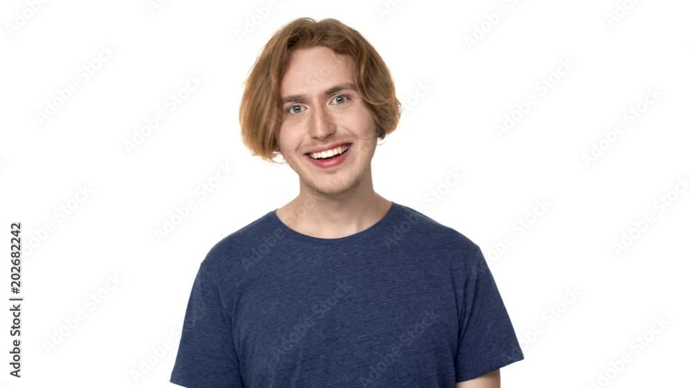 Portrait of surprised man in casual t-shirt laughing with perfect teeth and bulging eyes in astonishment, isolated over white background. Concept of emotions Portrait of surprised man in casual t-shirt laughing with perfect teeth and bulging eyes in astonishment, isolated over white background. Concept of emotions