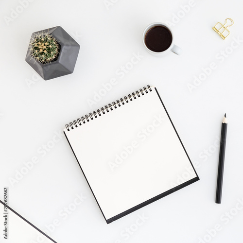 Flat lay design with notebook, coffee and pen. 
