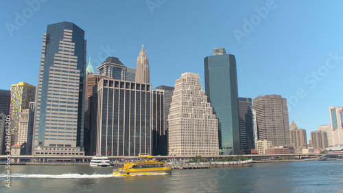 CLOSE UP  New York Water Taxi traveling along East River and Downtown Manhattan