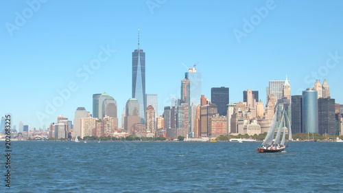 Tourists on scenic New York City sightseeing boat tour on beautiful sailboat