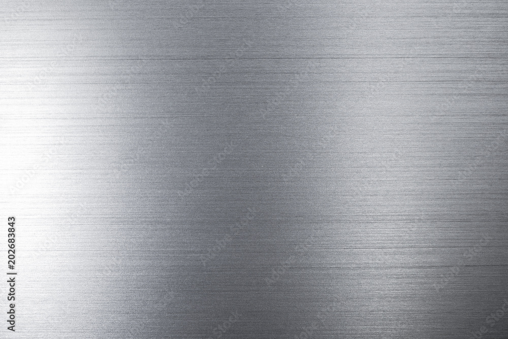 Close up industrial background of fractally scratched direct horizontal lines to silver metal/stainless steel surface. Creative detail macro photography.