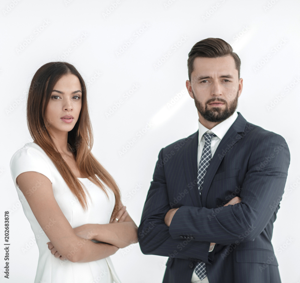 A business man and woman with their hands crossed