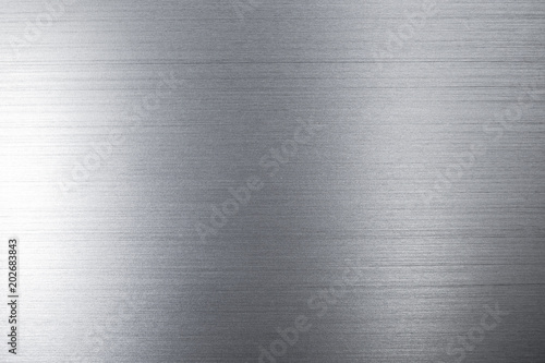 Obraz na płótnie Close up industrial background of fractally scratched direct horizontal lines to silver metal/stainless steel surface. Creative detail macro photography. w salonie