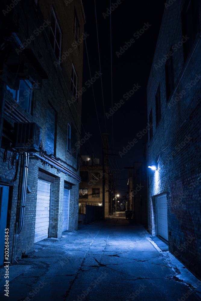 Dark and eerie urban city alley at night Dark and eerie urban city alley at night