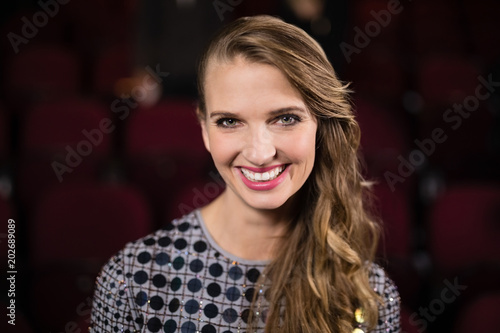 Woman standing in movie theatre