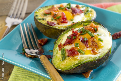 Baked avocados and eggs with bacon and chives