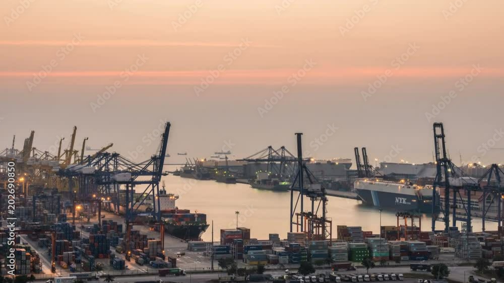 Container Cargo freight ship with working crane loading bridge in shipyard at dusk for Logistic Import Export background Container Cargo freight ship with working crane loading bridge in shipyard at dusk for Logistic Import Export background
