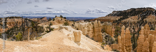 viewpoint of bryce canyon in utah in the spring time with snow on the ground and clear blue skies