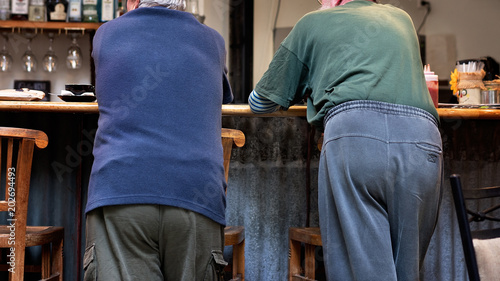 Принти на полотні Two Old Men Standing At A Bar