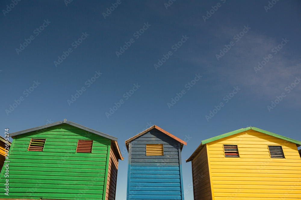 Low angle view of multi colored houses against sky Low angle view of multi colored houses against sky