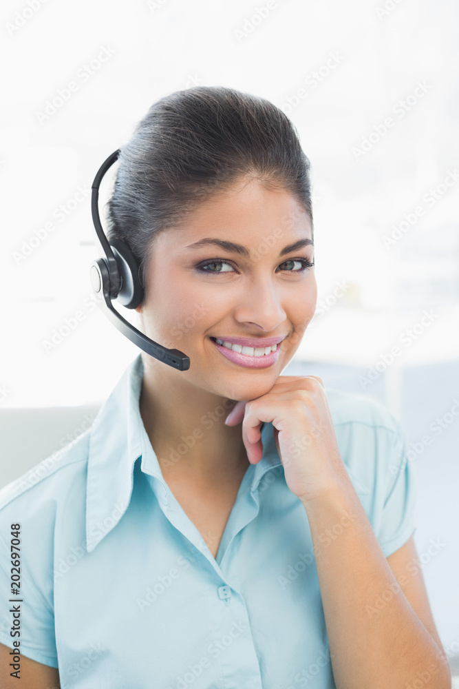 Close up of a businesswoman wearing headset Close up of a businesswoman wearing headset