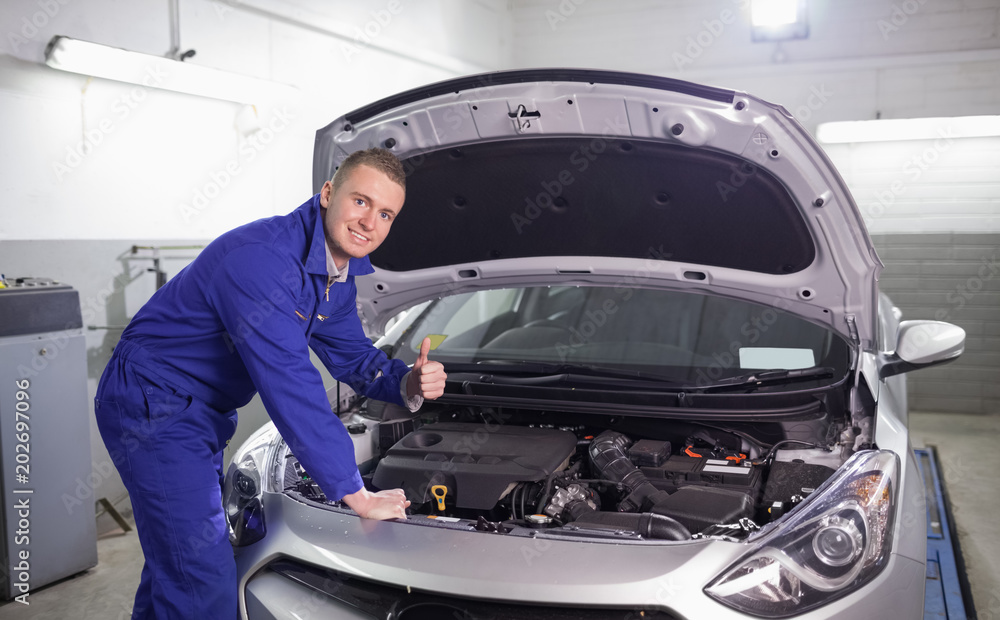 Mechanic with his thumb up Mechanic with his thumb up