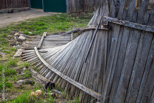 The fallen wooden fence
