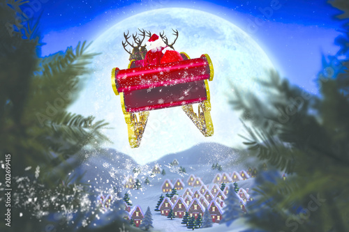Santa flying his sleigh against christmas village under full moon