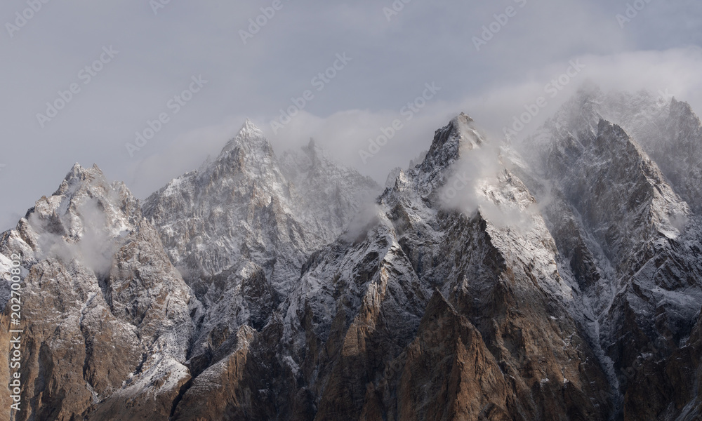 Passu Cathedral mountain peak with cloudy and foggy environment in Pakistan