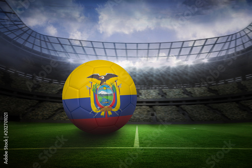 Football in ecuador colours in large football stadium with lights