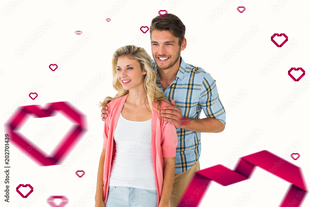Attractive young couple smiling together against hearts Attractive young couple smiling together against hearts