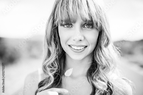 Black and white photograph of smiling natural blonde 