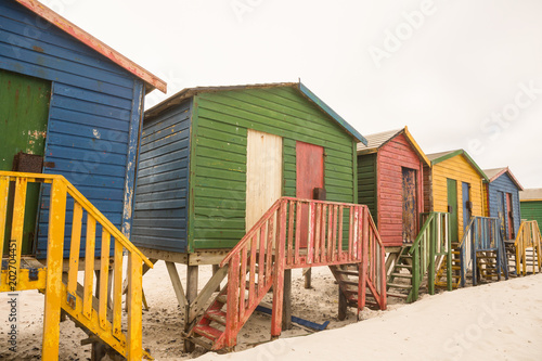 Wooden colorful huts on sand © WavebreakmediaMicro