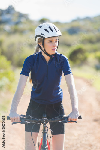Serious woman with her bike