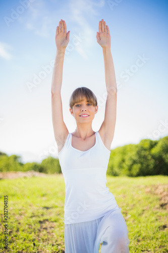 Happy young woman stretching outside © WavebreakmediaMicro