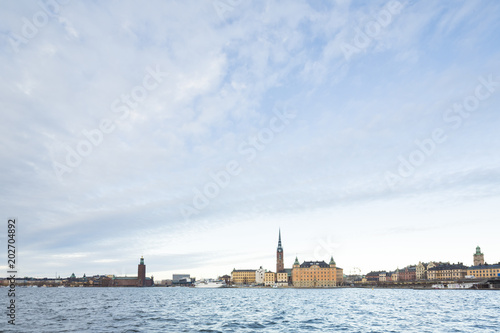 Beautiful scenic panorama of the Old City (Gamla Stan) cityscape pier architecture with historic town houses with colored facade in Stockholm, Sweden. Creative landscape photography