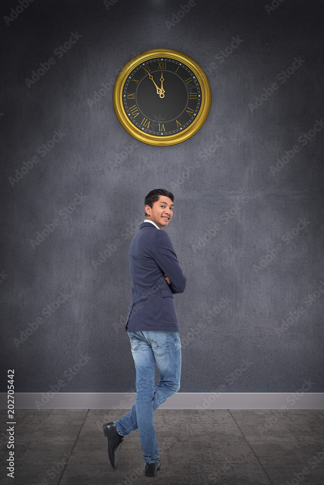 Smiling casual businessman with arms crossed against grey room Smiling casual businessman with arms crossed against grey room