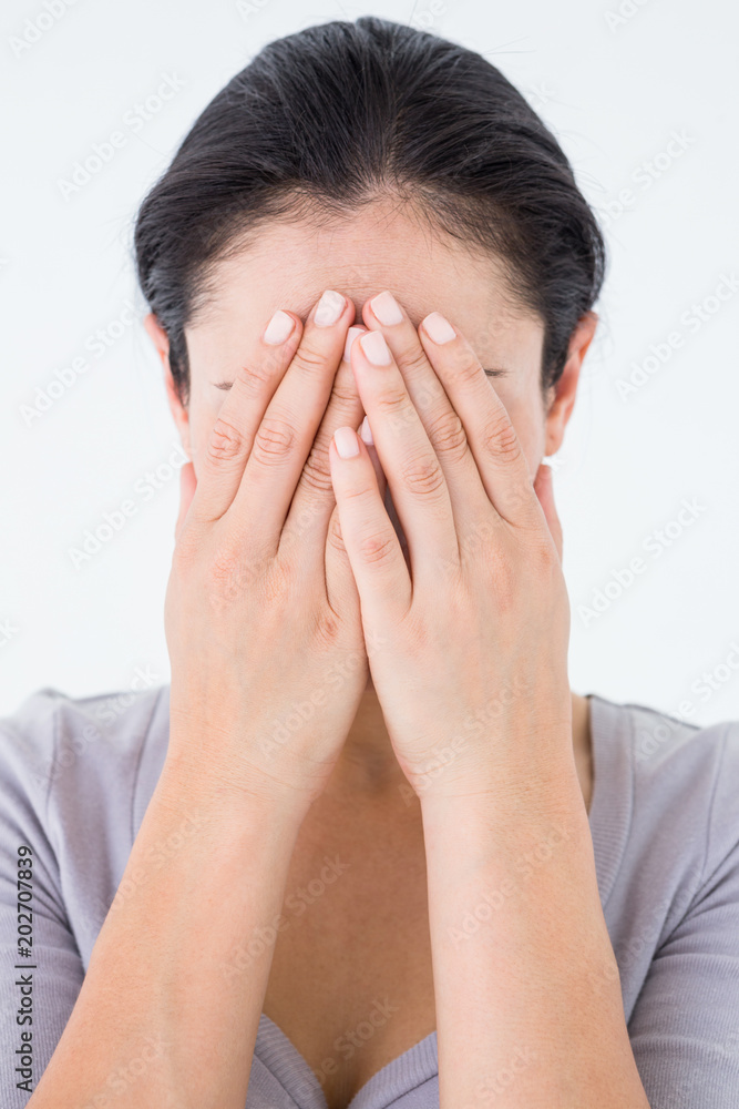 Sad woman hiding her face Sad woman hiding her face