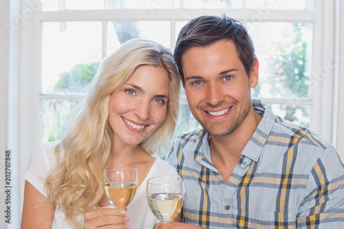 Close-up of a happy loving couple with wine glasses