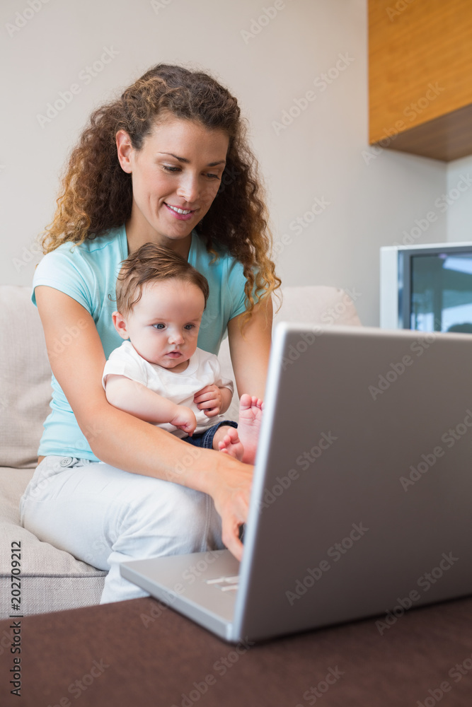 Baby with mother using laptop Baby with mother using laptop