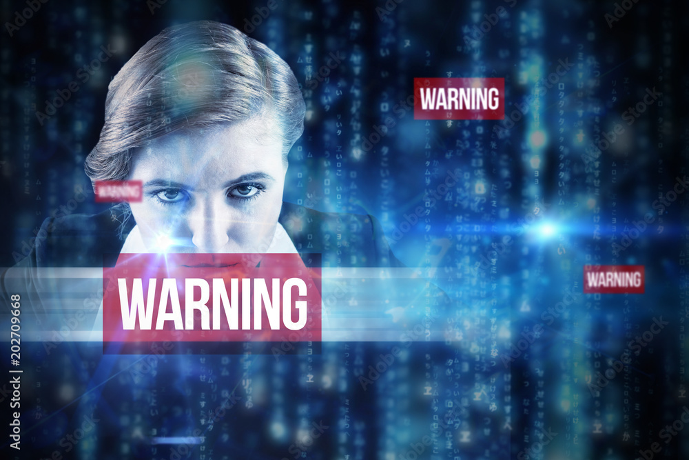 Φωτογραφία The word warning and focused businesswoman against lines of blue blurred letters