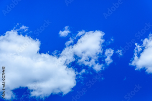 Fototapeta Naklejka Na Ścianę i Meble -  White fluffy clouds in a deep blue sky