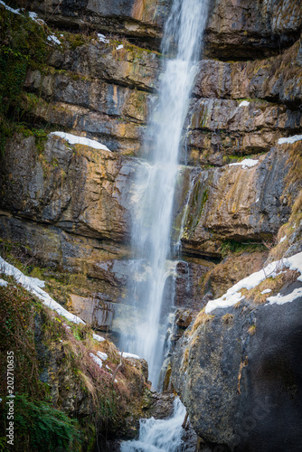 Waterfall in the mountain Austrian village of Hallstatt. Austria