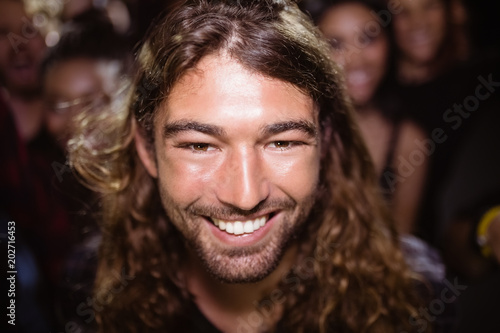 portrait of happy young man at nightclub