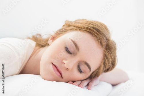Close up of a pretty woman sleeping in bed