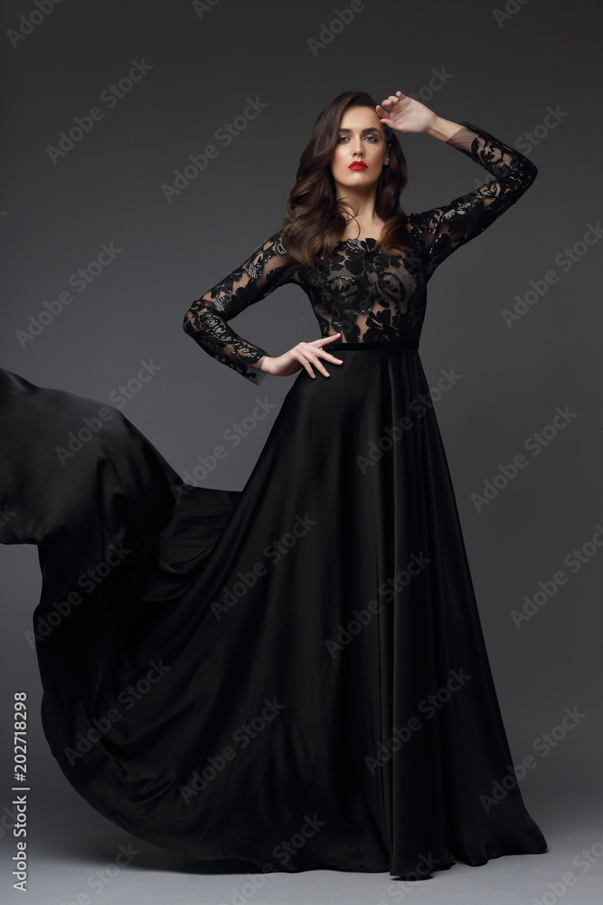 Young elegant woman in long black dress.