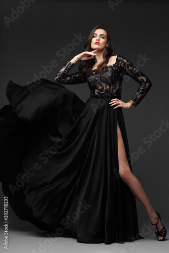 Young elegant woman in long black dress.