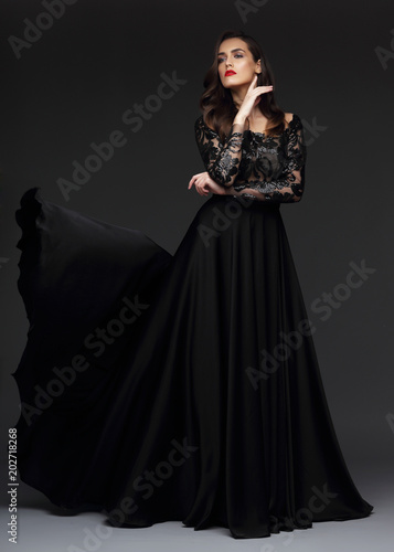 Young elegant woman in long black dress.