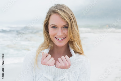Portrait of a smiling casual young woman at beach