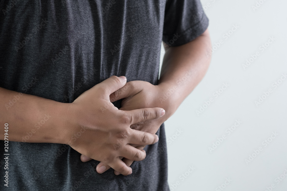 man stomach suffering and having a stomachache man stomach suffering and having a stomachache