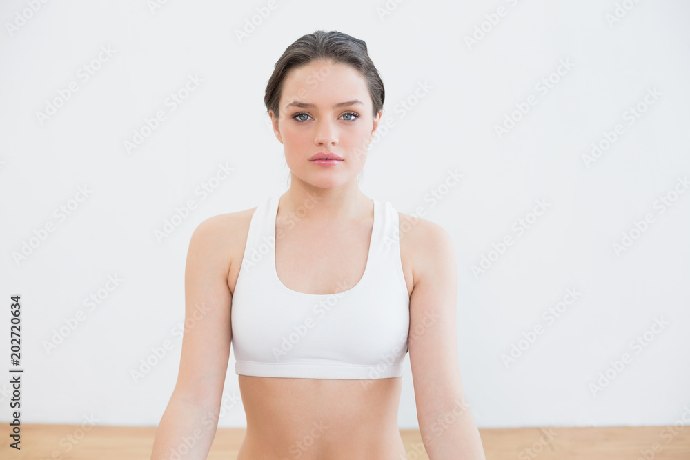 Fit young woman at fitness studio