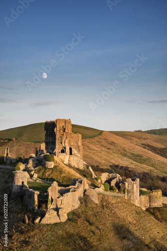 Fantastic old Medieval castle ruins during beautiful Autumn sunset